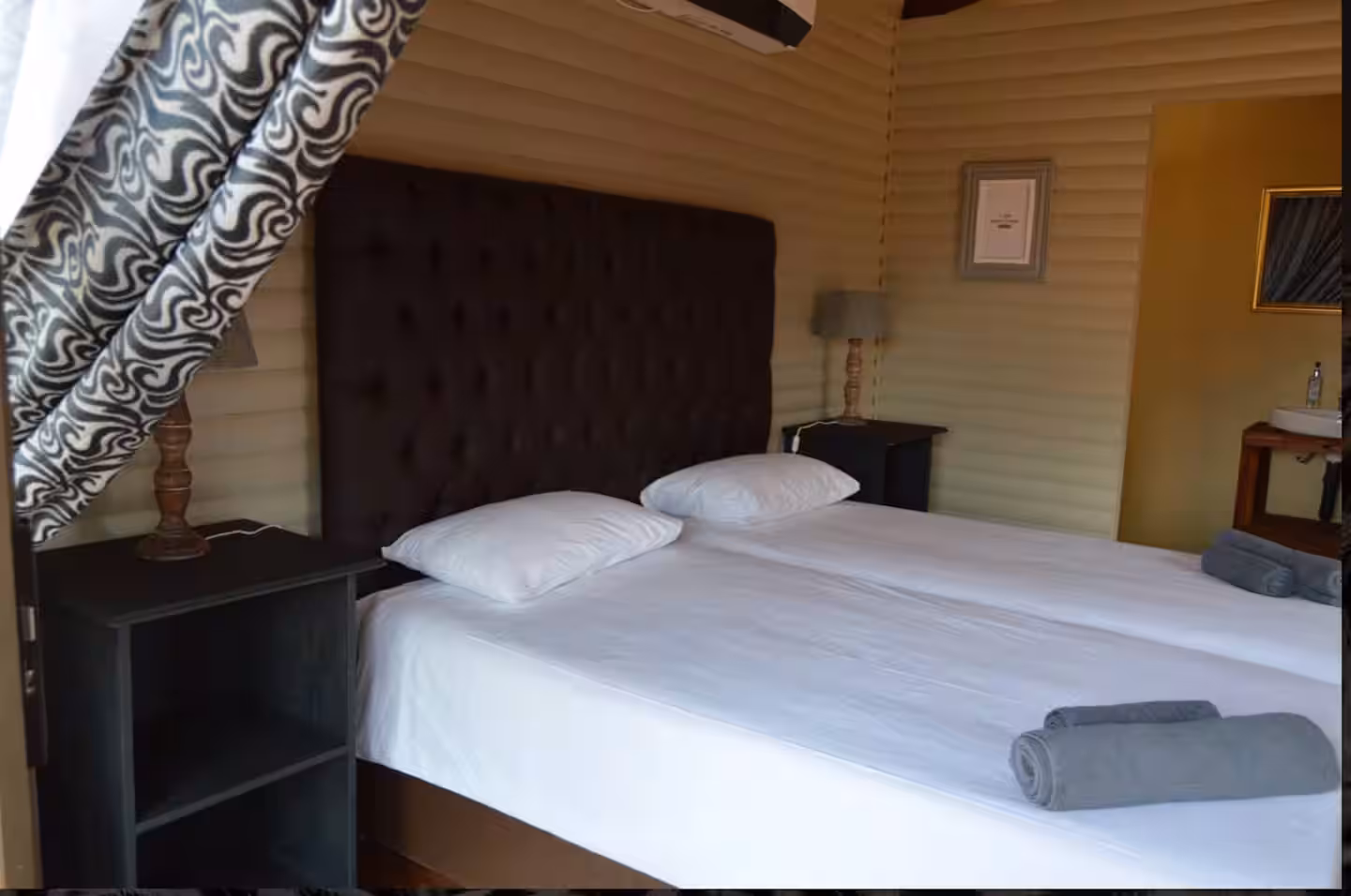 Standard Cabin Interior - Twin beds with air conditioning and private bathroom at Maseri Cabins